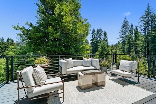 wooden deck featuring an outdoor living space