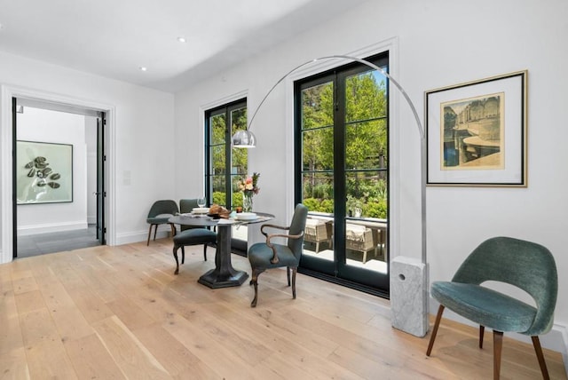 doorway featuring french doors and light hardwood / wood-style floors