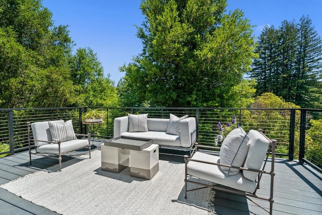 wooden deck featuring an outdoor living space