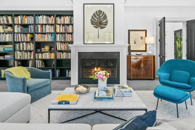 sitting room featuring crown molding