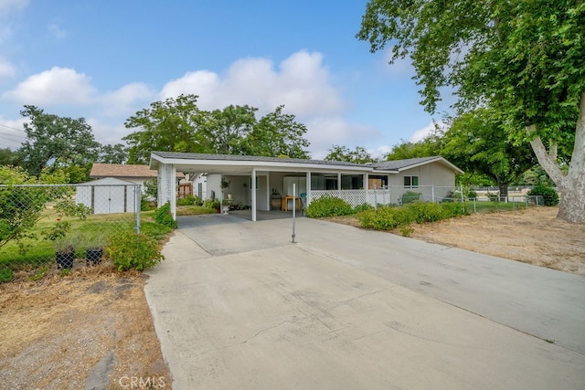 ranch-style house featuring a carport