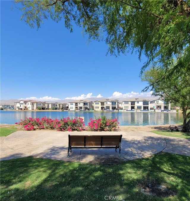 surrounding community featuring a water view