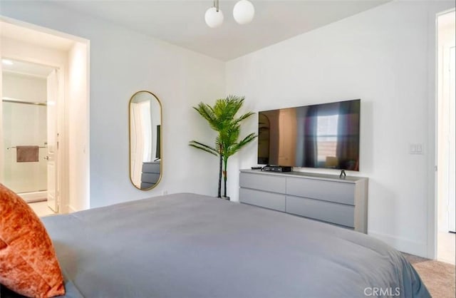 carpeted bedroom with ensuite bathroom