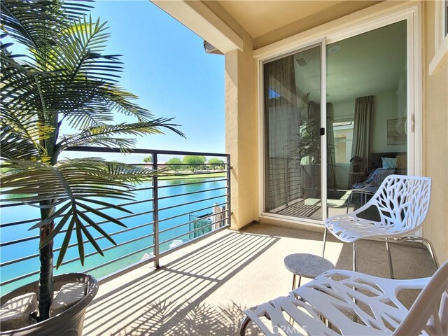 balcony featuring a water view