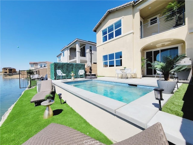 view of pool featuring a water view