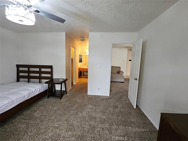 carpeted bedroom with a textured ceiling and ceiling fan