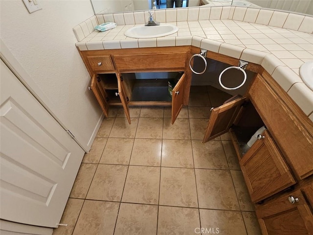 interior space with vanity and tile patterned floors