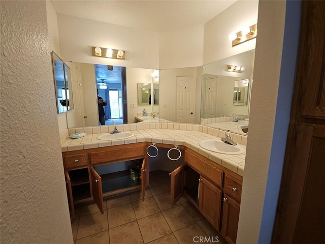 bathroom featuring tile patterned flooring and vanity