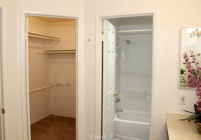 bathroom featuring shower with separate bathtub