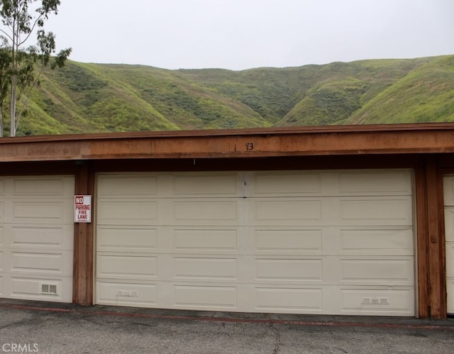 garage featuring a mountain view