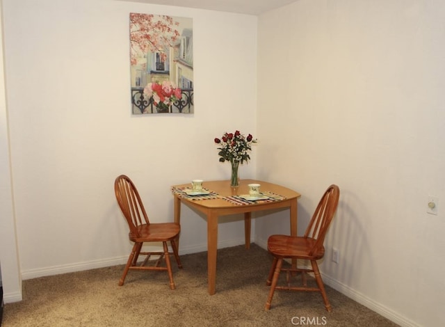 view of carpeted dining area