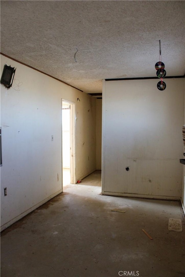 empty room featuring a textured ceiling