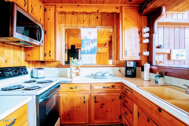 kitchen with electric stove and wood ceiling