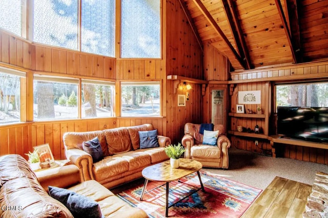 living room with high vaulted ceiling, wooden walls, beam ceiling, and wood ceiling