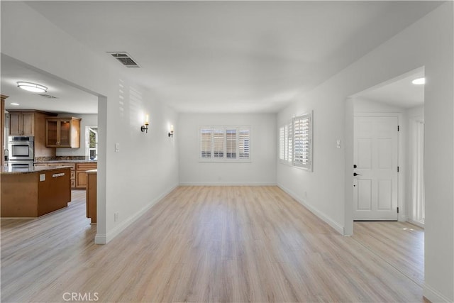 unfurnished living room featuring light hardwood / wood-style flooring