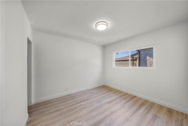 empty room with light hardwood / wood-style floors