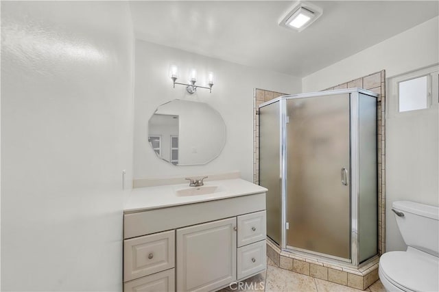 bathroom featuring toilet, walk in shower, tile patterned floors, and vanity