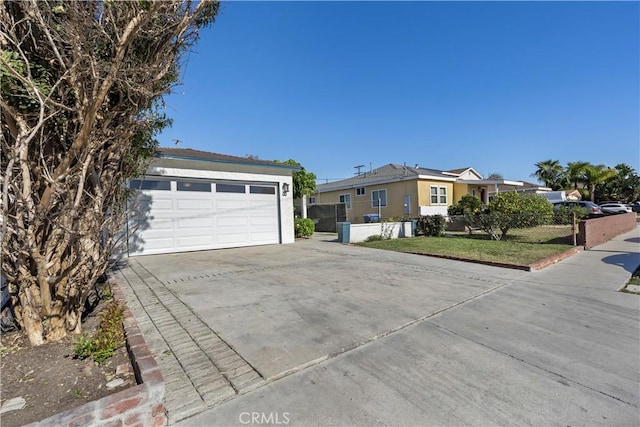 view of front facade with a garage and a front lawn