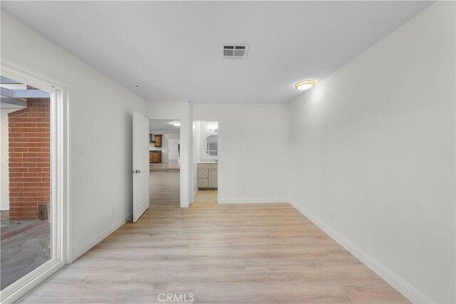 unfurnished room featuring light wood-type flooring