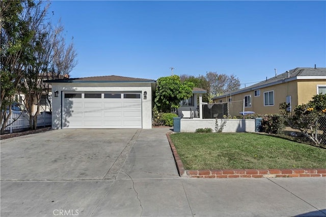 single story home featuring a garage and a front yard