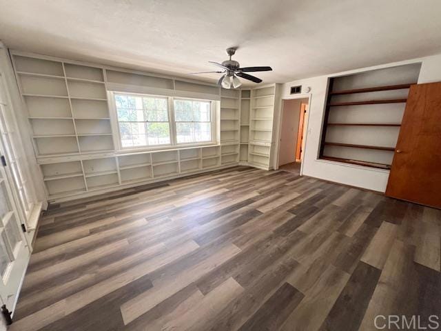 unfurnished bedroom featuring dark hardwood / wood-style floors and ceiling fan