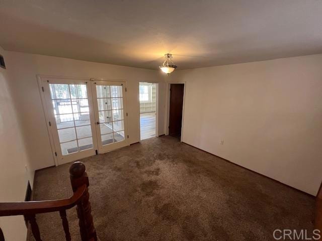 spare room featuring carpet