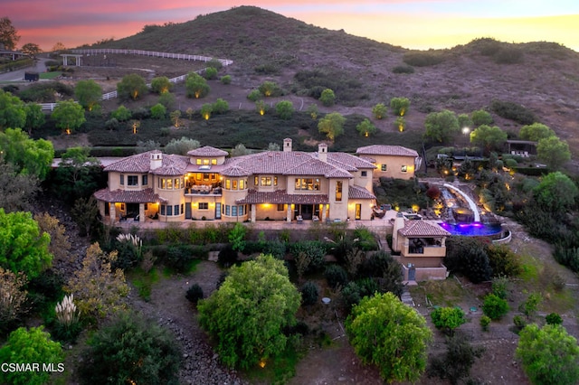 aerial view at dusk with a mountain view