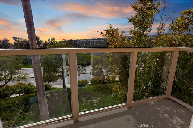 view of balcony at dusk