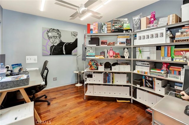 office with dark hardwood / wood-style floors and ceiling fan