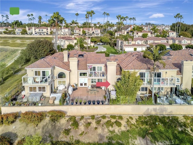 birds eye view of property with a residential view