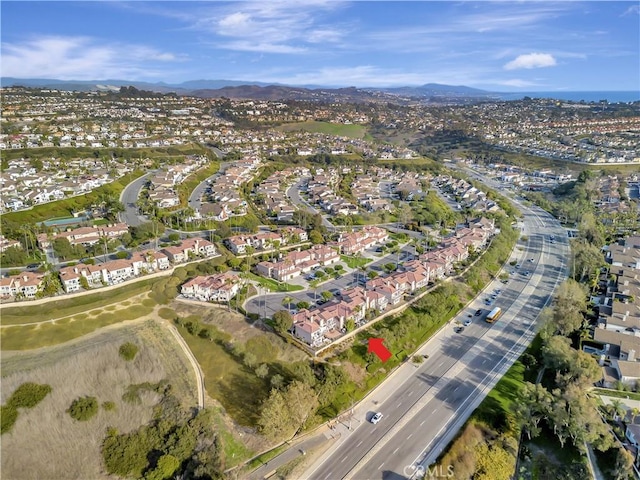 birds eye view of property featuring a mountain view and a residential view