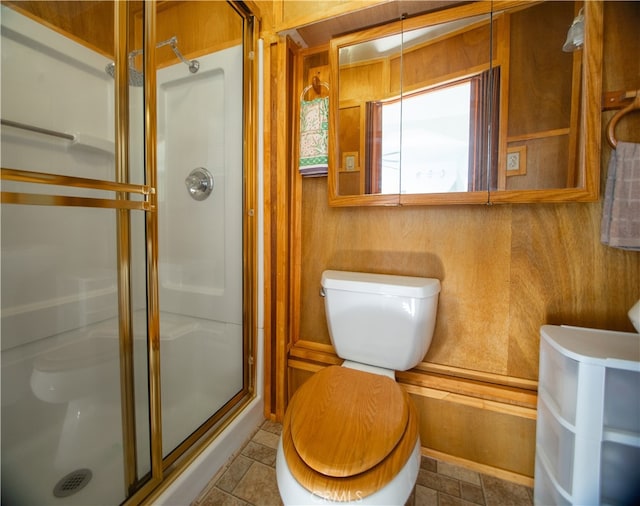 bathroom featuring toilet and walk in shower