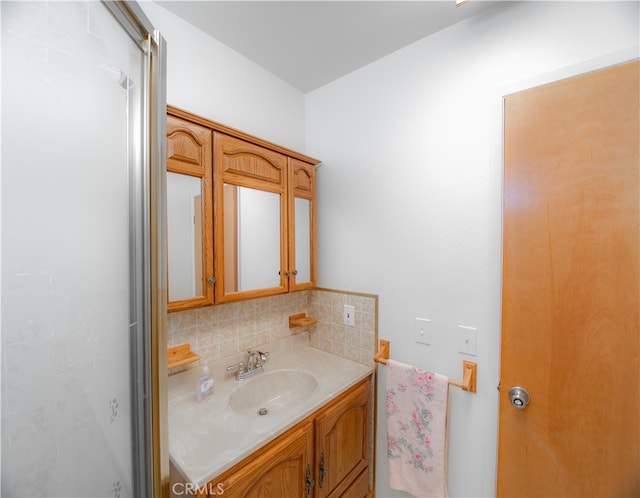 bathroom with vanity and backsplash