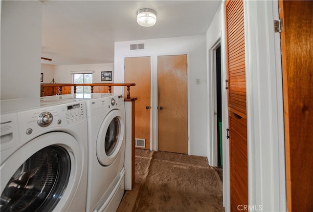 laundry area with carpet and washer and dryer