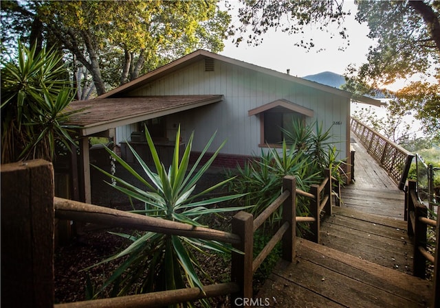 view of property exterior with a deck