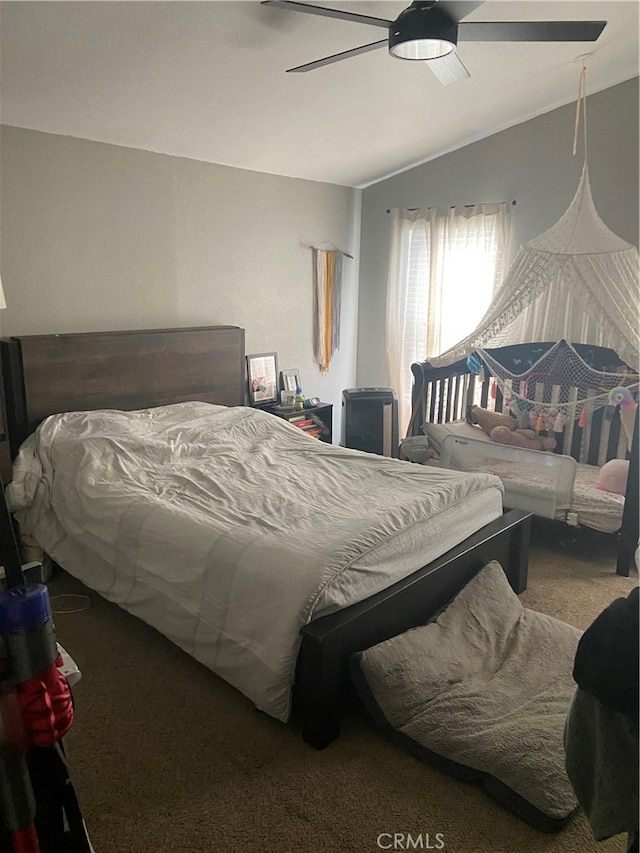 bedroom with ceiling fan and carpet flooring