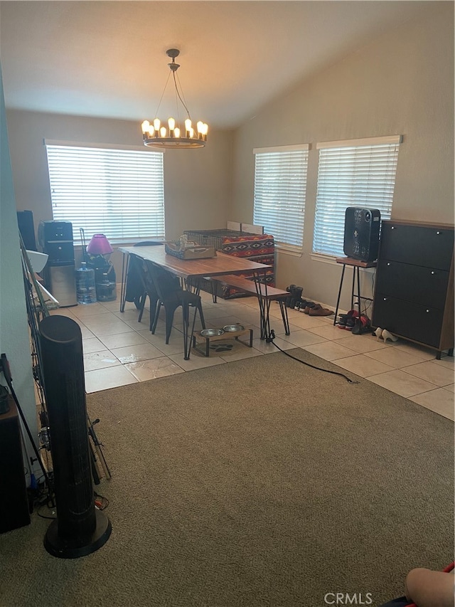 dining room featuring vaulted ceiling, light tile floors, and a chandelier