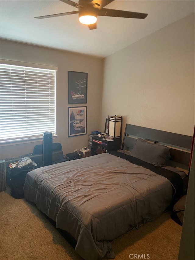 bedroom featuring ceiling fan and carpet floors