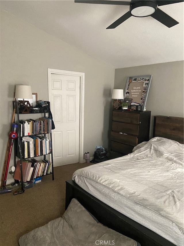 bedroom with ceiling fan, carpet floors, and lofted ceiling