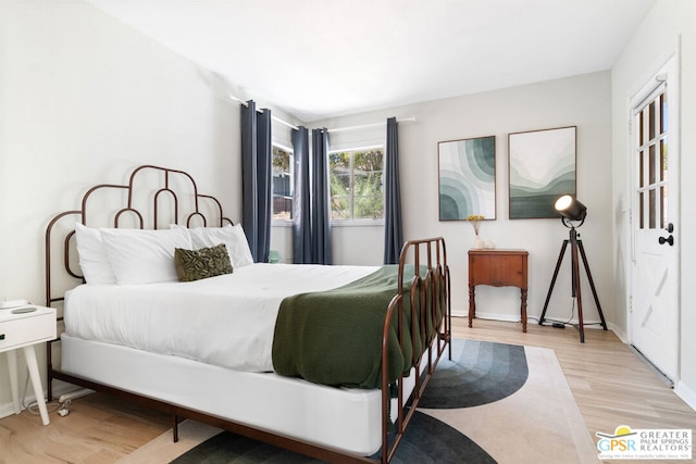 bedroom with light wood-type flooring