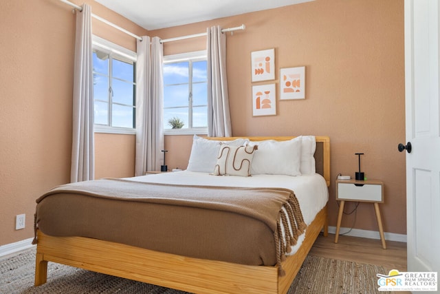 bedroom featuring hardwood / wood-style floors