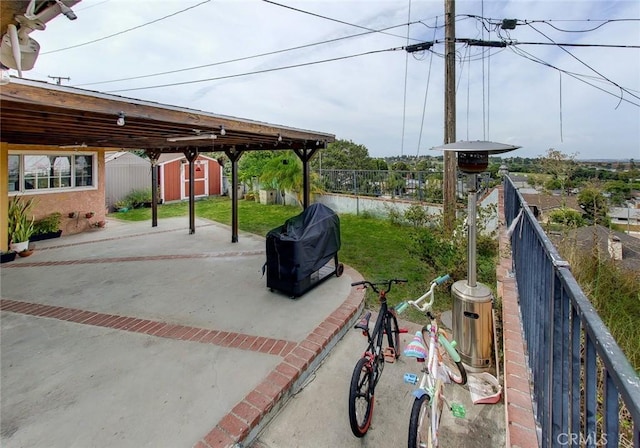 exterior space with area for grilling and a storage shed