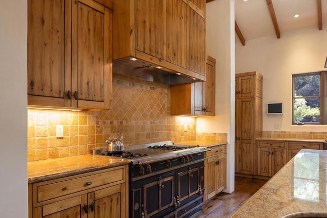 kitchen featuring light stone countertops, vaulted ceiling with beams, decorative backsplash, dark hardwood / wood-style floors, and gas stovetop