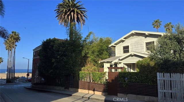 view of side of home with a water view