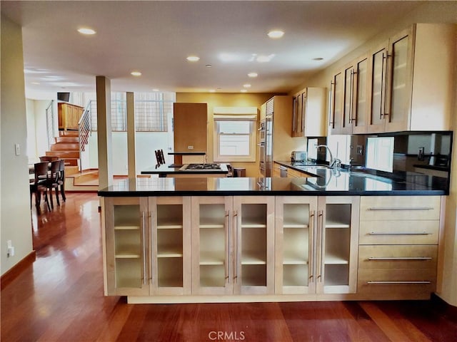 kitchen featuring hardwood / wood-style floors and sink