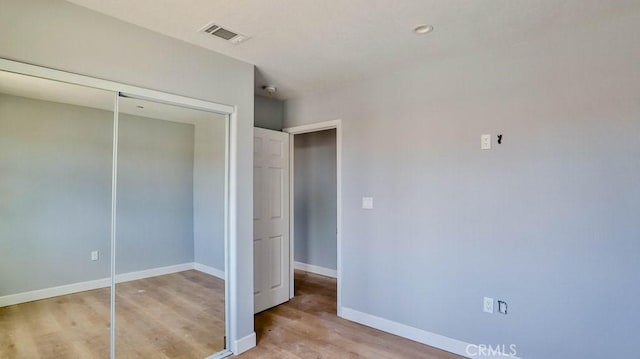 unfurnished bedroom featuring light hardwood / wood-style flooring