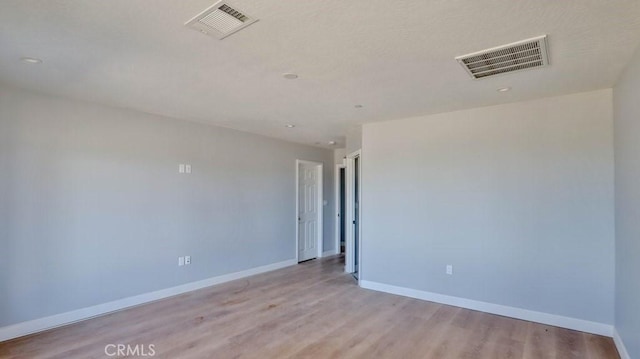 empty room with light wood-type flooring