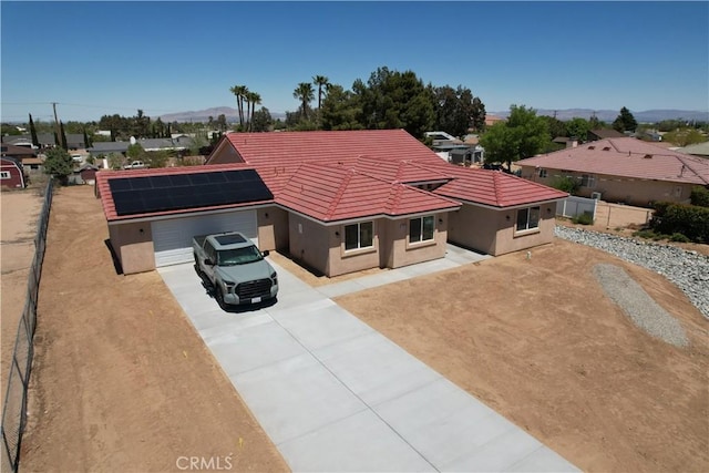 birds eye view of property with a mountain view