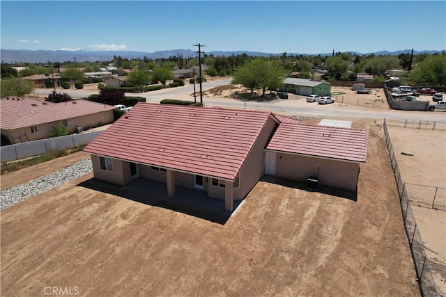 birds eye view of property featuring a mountain view