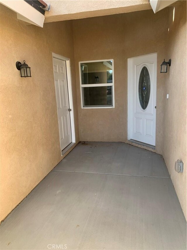 doorway to property featuring a patio